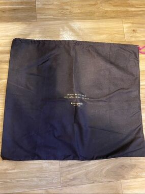 kate spade brown dust pouch with pink drawstring